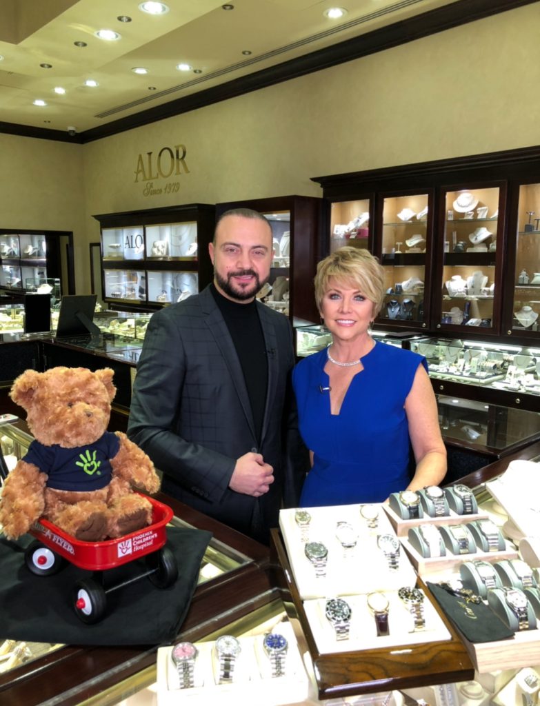 Frank Isaac with a guest at the watch counter